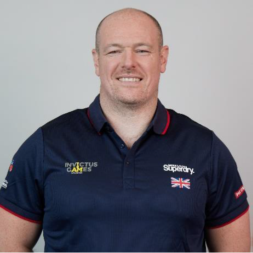 Personnel wears Invictus Games uniform in portrait.
